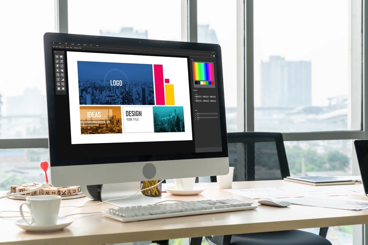 Logo design and brand identity creation on desktop computer