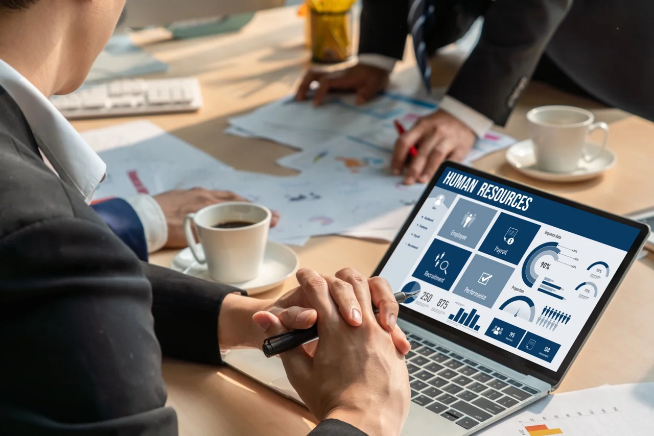 Human resources analytics dashboard displayed during business meeting