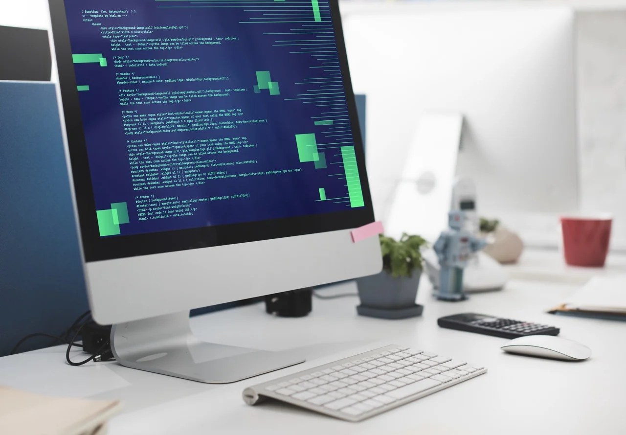 Web development source code displayed on desktop computer screen